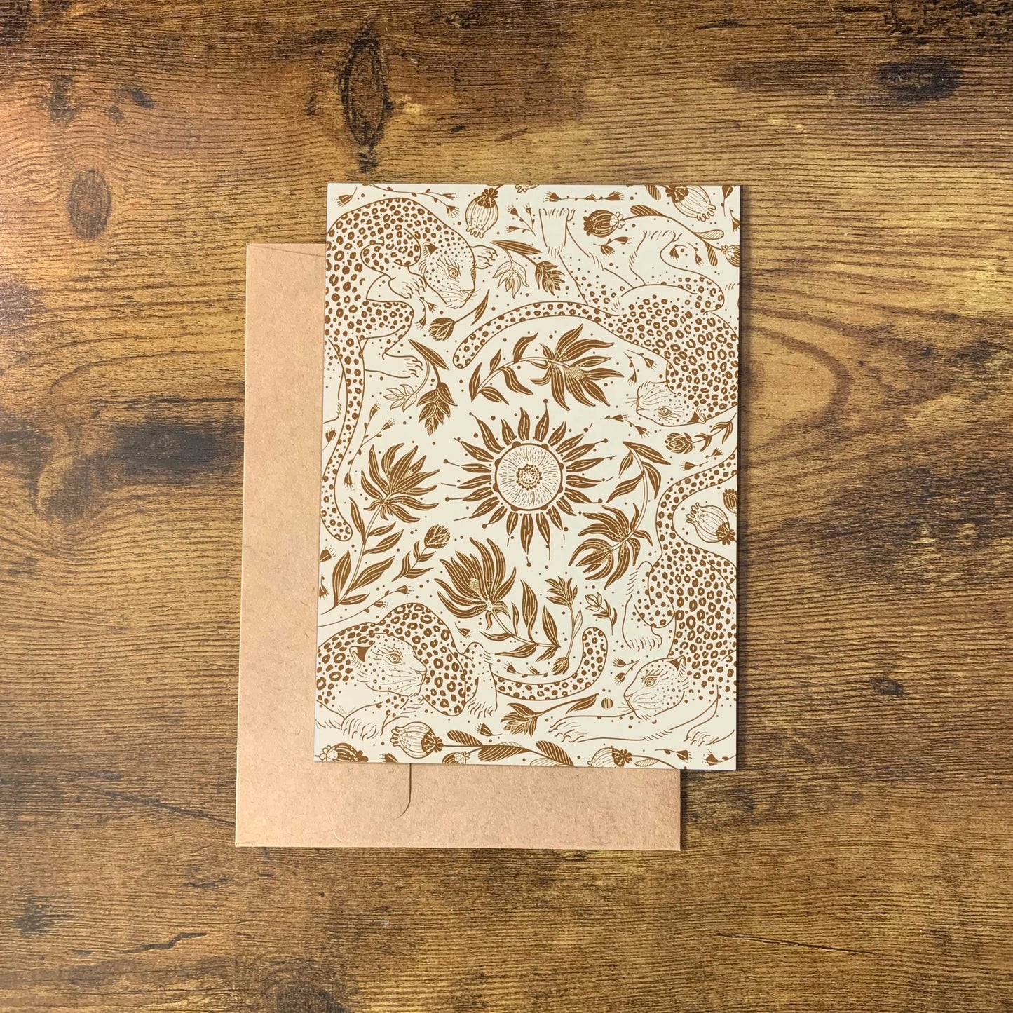 Leopard and Sun canvas tote bag design featuring line art of leopards and floral patterns on a beige background.