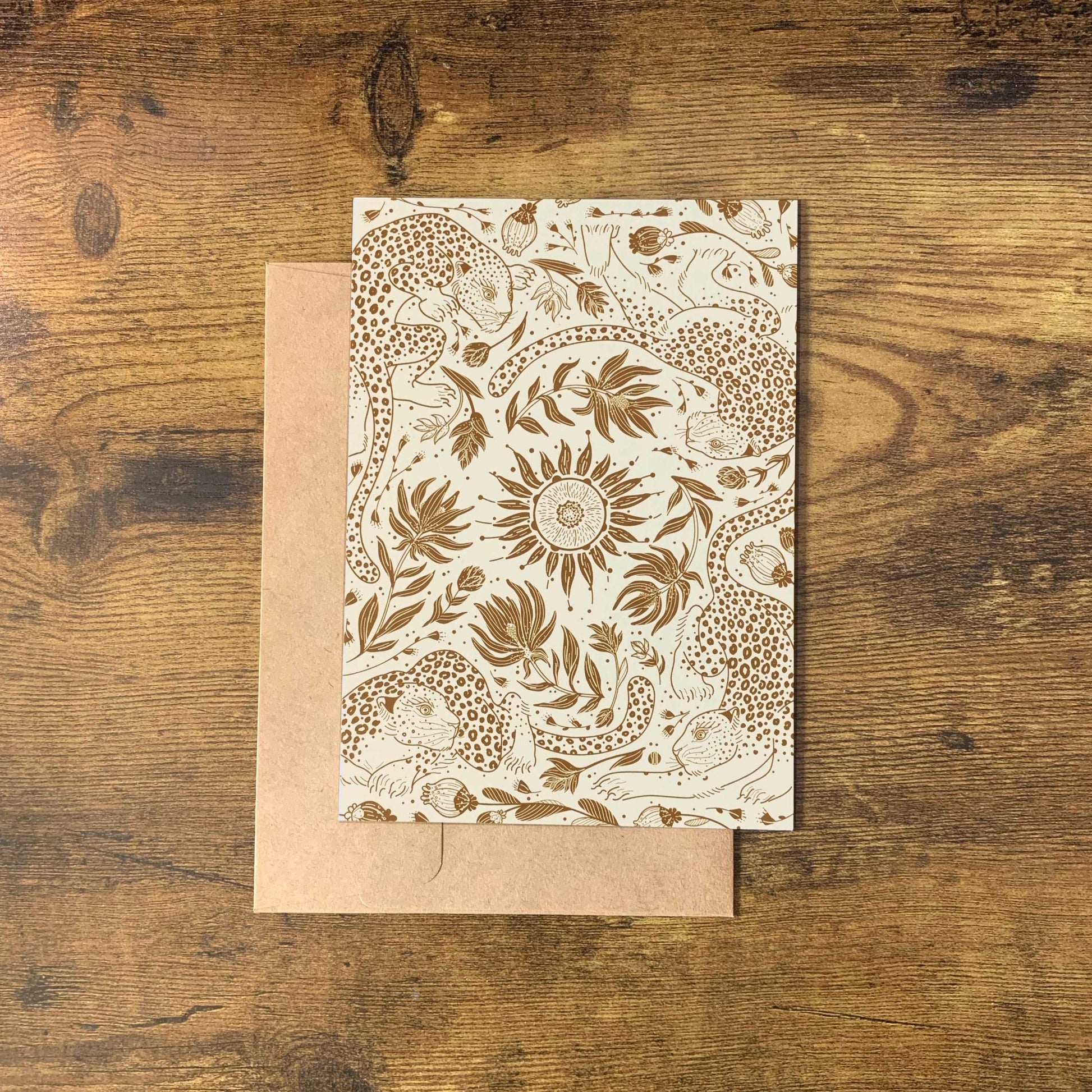 Leopard and Sun canvas tote bag design featuring line art of leopards and floral patterns on a beige background.