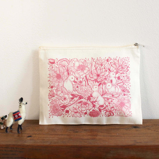 Canvas zipper pouch with floral bunny design, perfect for cosmetics, pencils, or coins.