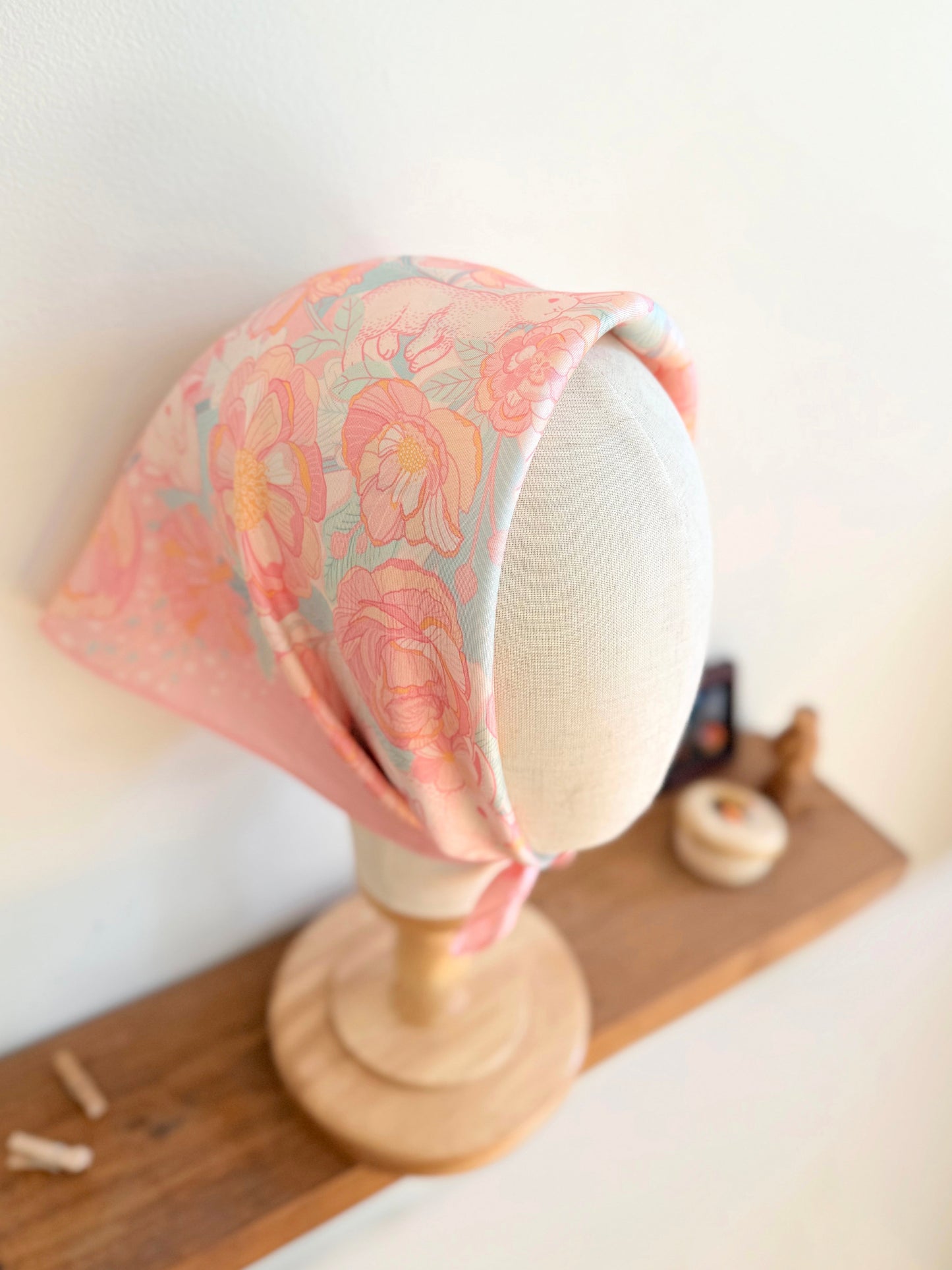 Bunny in the Floral Breeze Silk Twill Scarf displayed on a mannequin, showcasing vibrant floral design on soft silk.