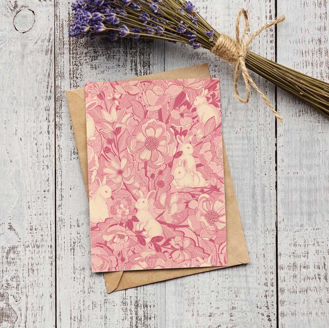 Floral bunny art print postcard on a rustic wooden background with dried lavender.