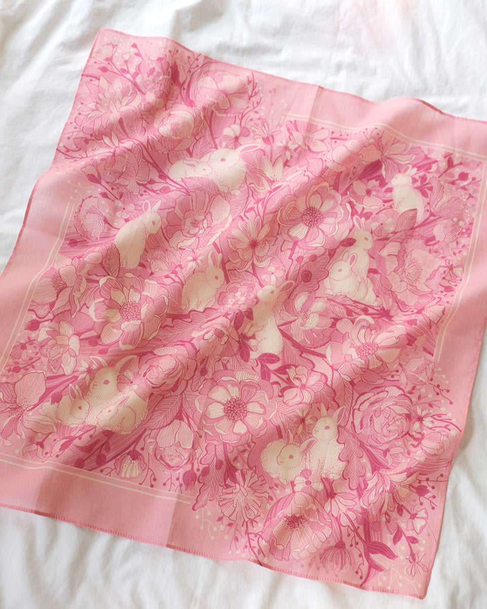 Bunny in the Floral Breeze Bandana Scarf in pink, featuring rabbit and flower artwork, perfect for various styling needs.