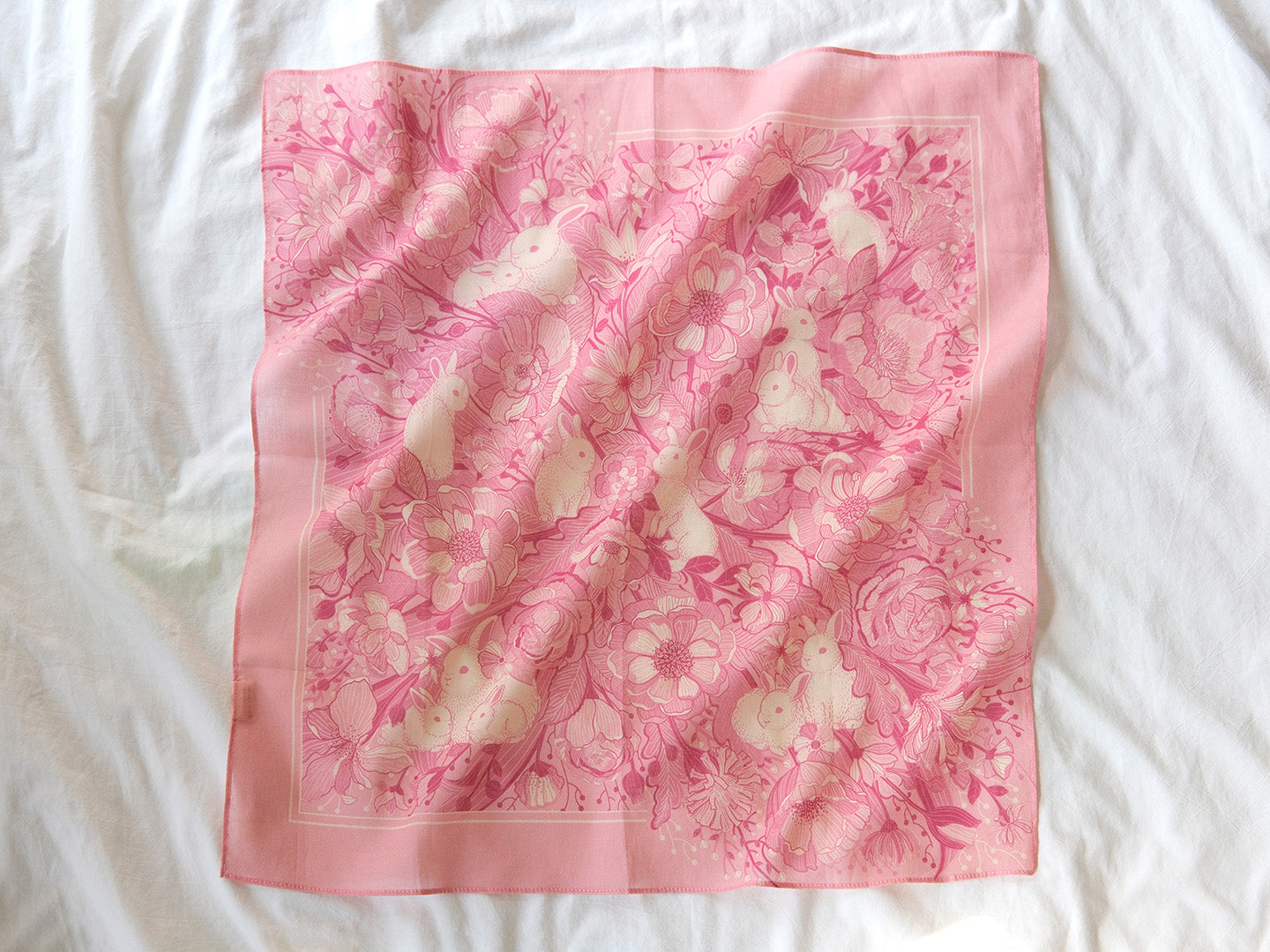 Bunny in the Floral Breeze Bandana Scarf in pink, featuring soft cotton and floral designs, ideal for accessories and decor.