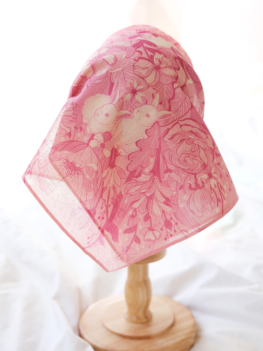 Bunny in the Floral Breeze Bandana Scarf in pink, featuring rabbit and flower designs, perfect for accessories and decor.
