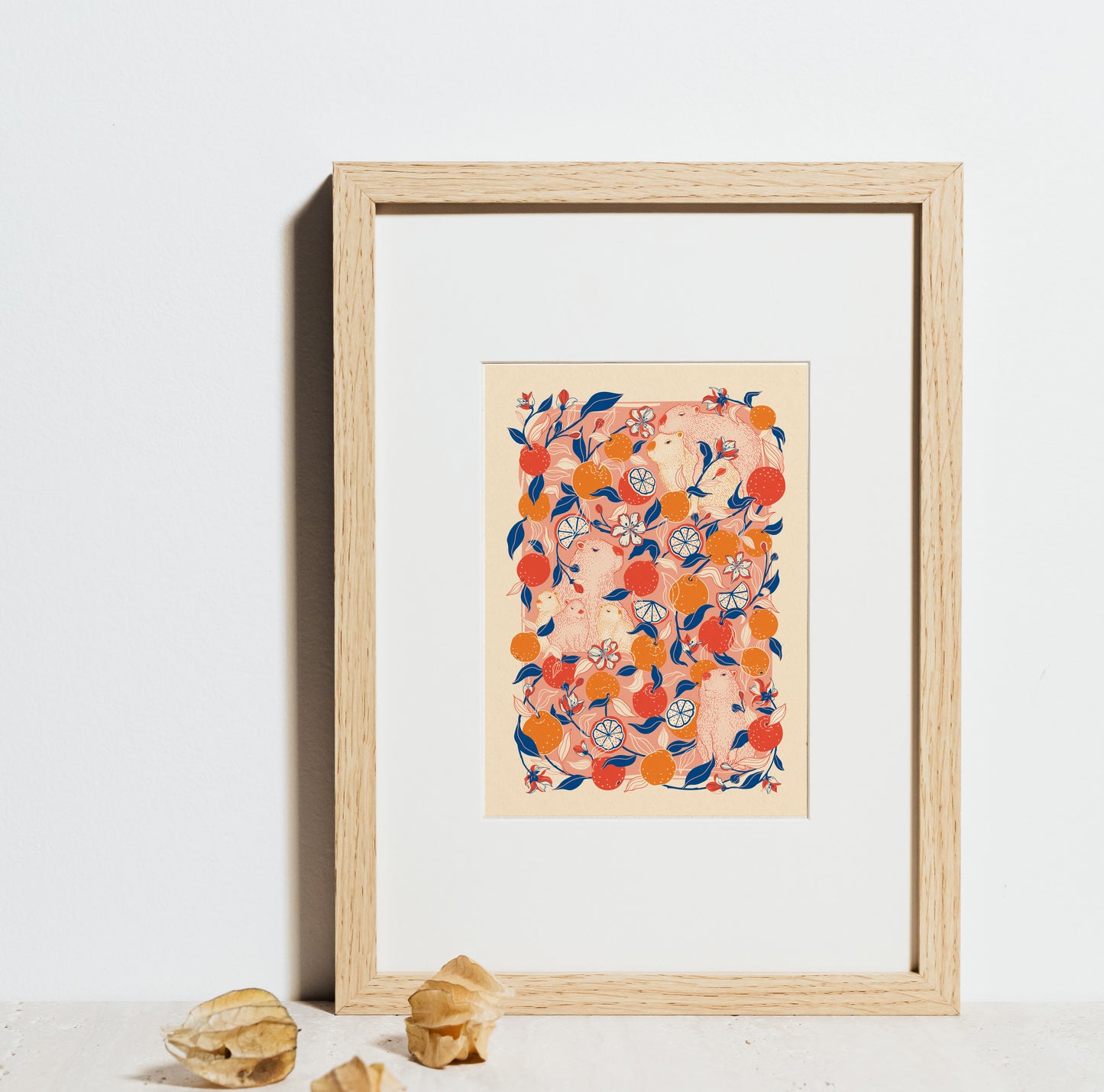 Framed artwork with a colorful capybara with yuzu orange design on a white background