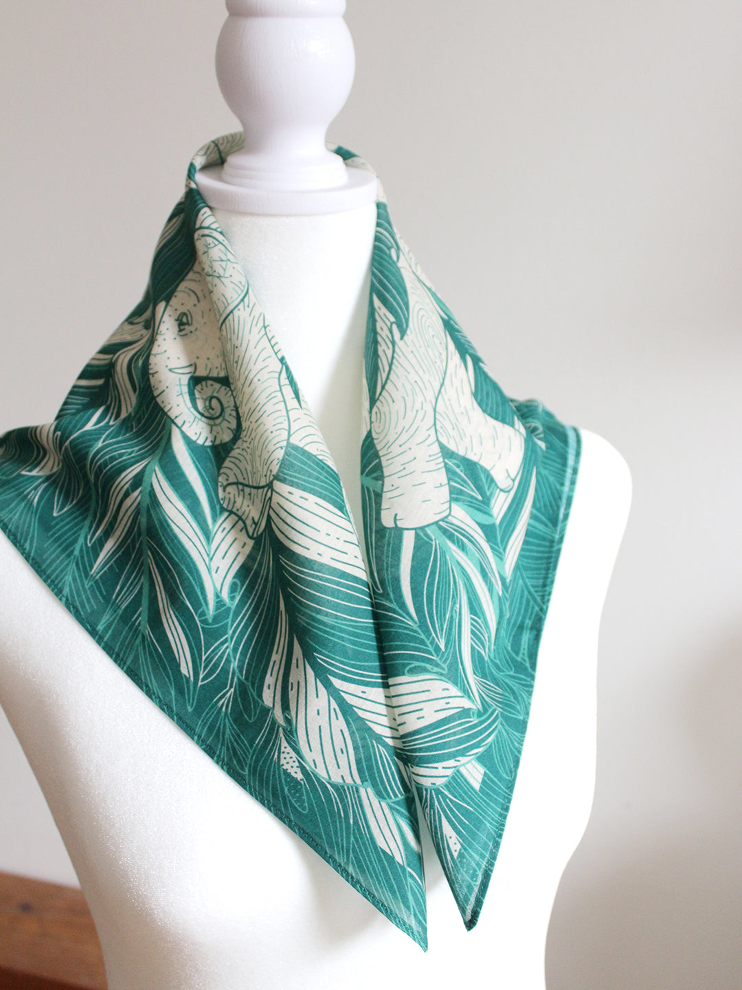 Green Elephant 'Siesta' bandana scarf featuring jungle artwork, perfect for accessories or pet wear.