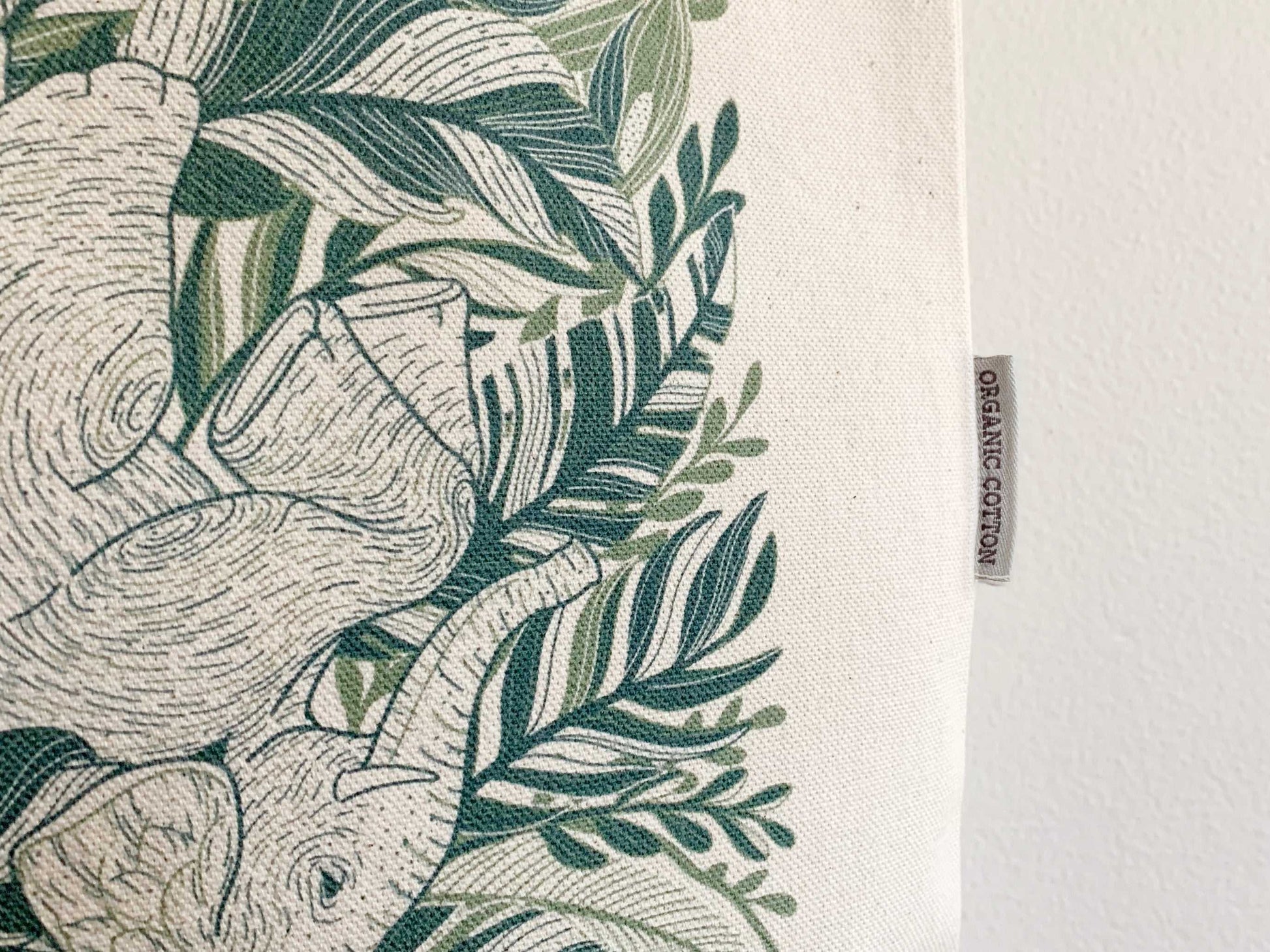 Detail of Elephant "Siesta" Canvas Tote Bag featuring beautiful elephant artwork and organic cotton label.