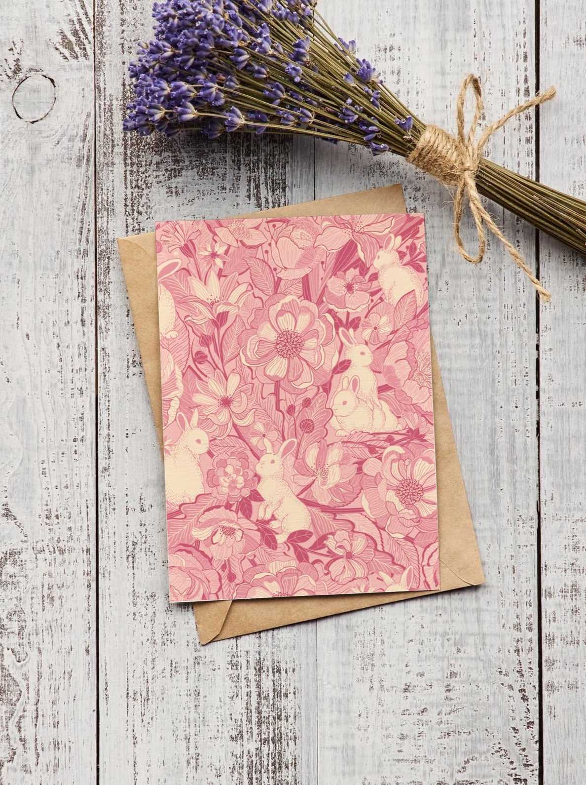 Floral bunny art print postcard on a rustic wooden background with dried lavender.