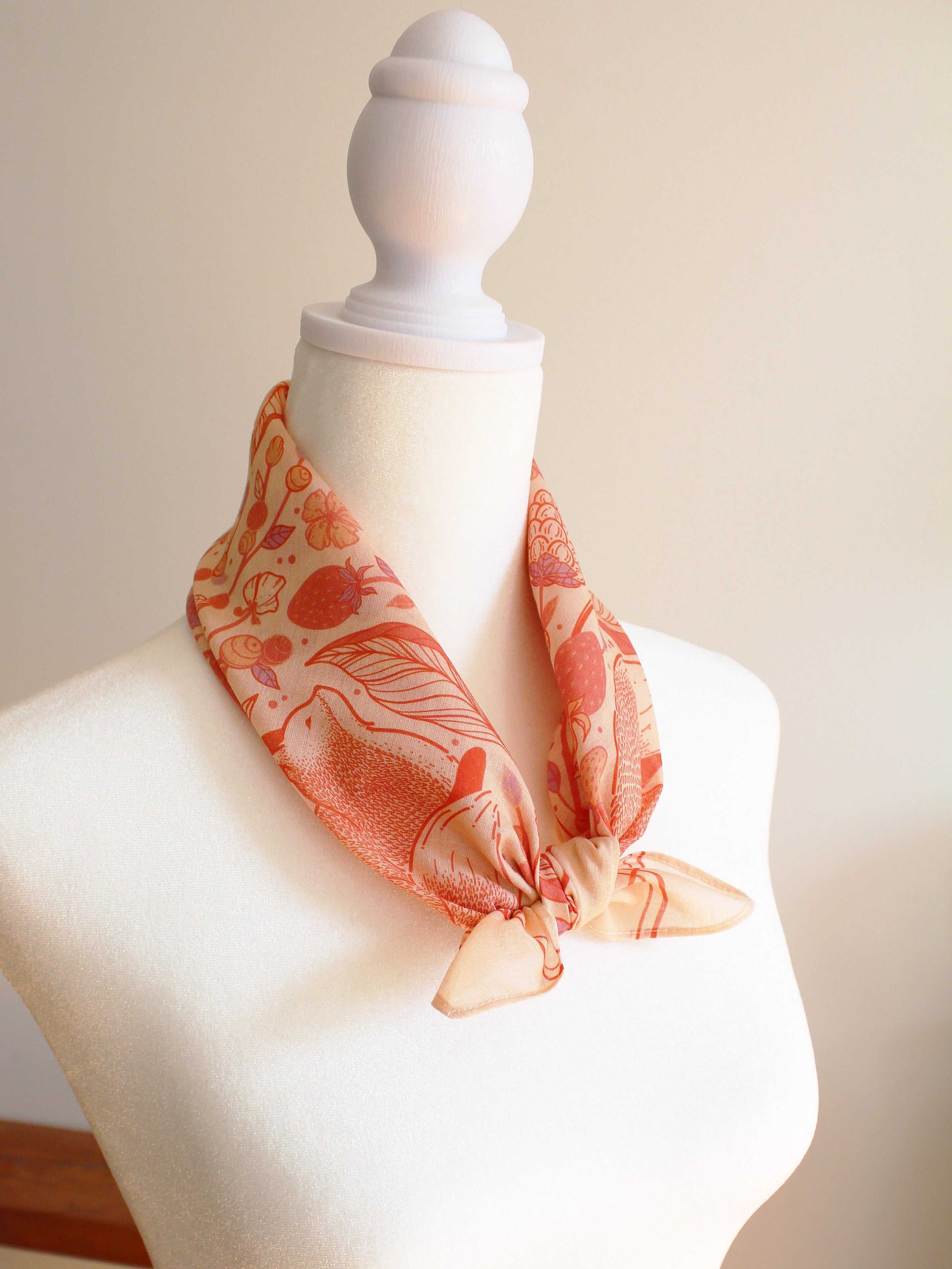 Fox&Berry blush bandana scarf featuring red fox and berry artwork, displayed on a mannequin.