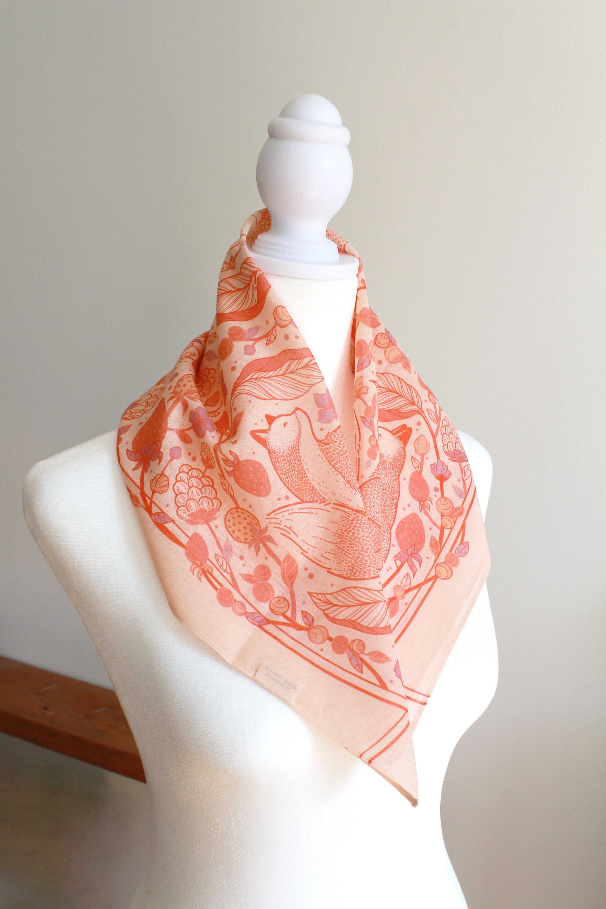 Blush Fox&Berry Bandana Scarf on mannequin featuring red fox and berry artwork.