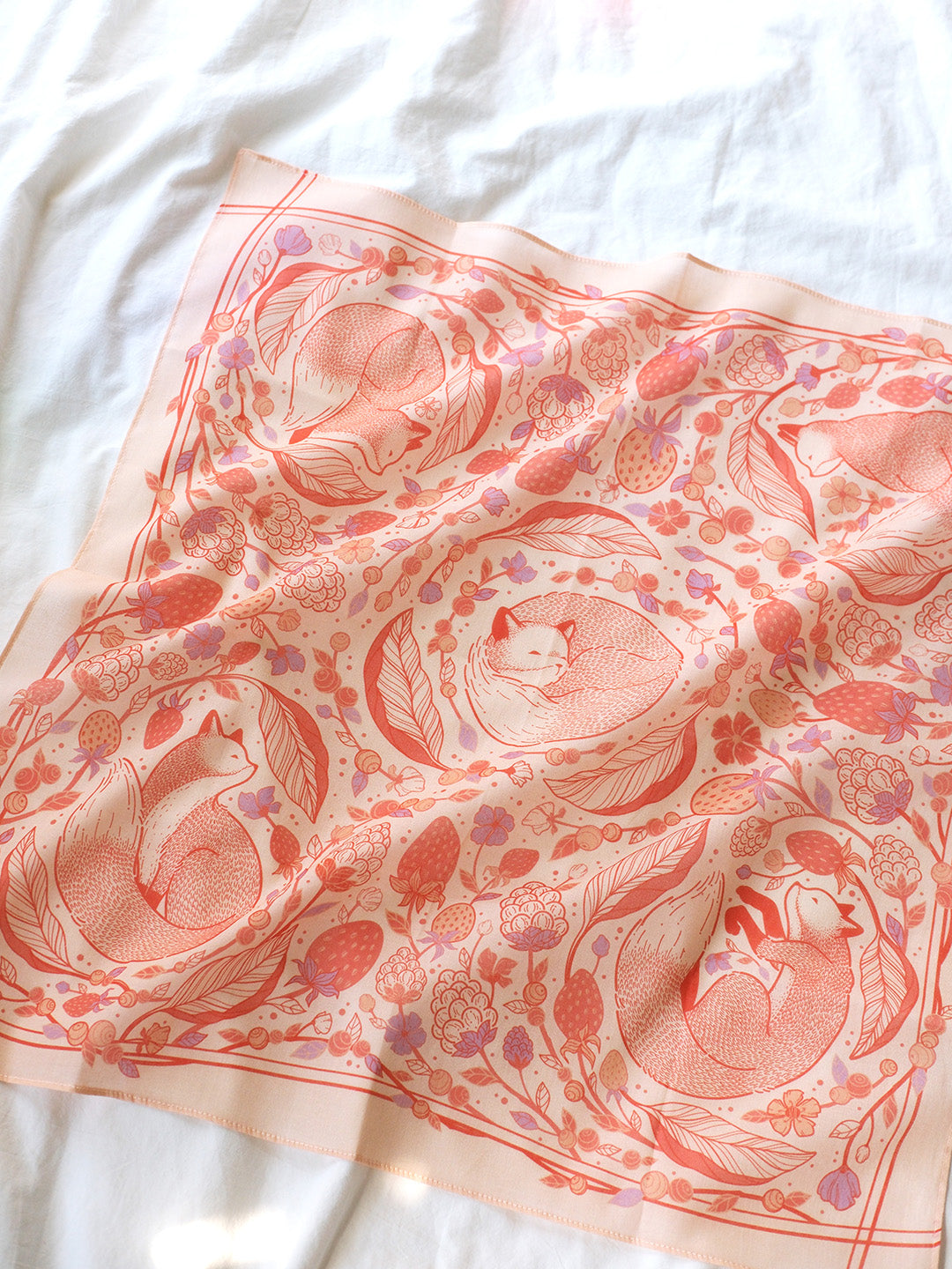 Fox&Berry Blush Bandana Scarf featuring illustrated red foxes and berries on soft cotton fabric.