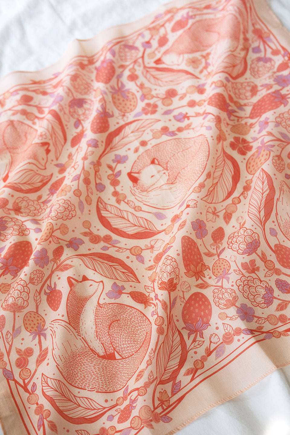 Fox&Berry Bandana Scarf in blush, featuring illustrated red foxes and berries on soft cotton fabric.