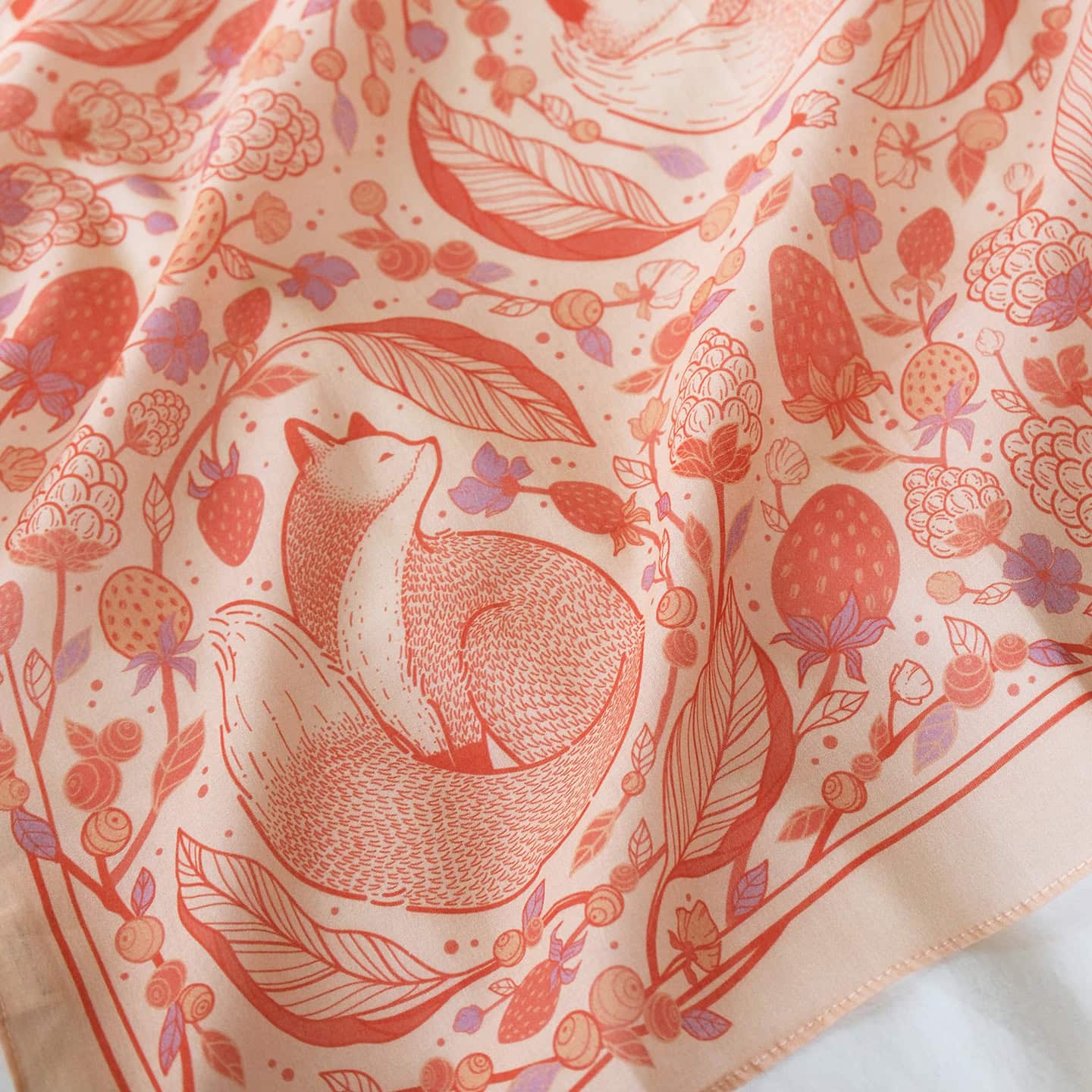 Fox&Berry Bandana Scarf featuring illustrated red foxes and berries on a blush background, perfect for accessories or decor.