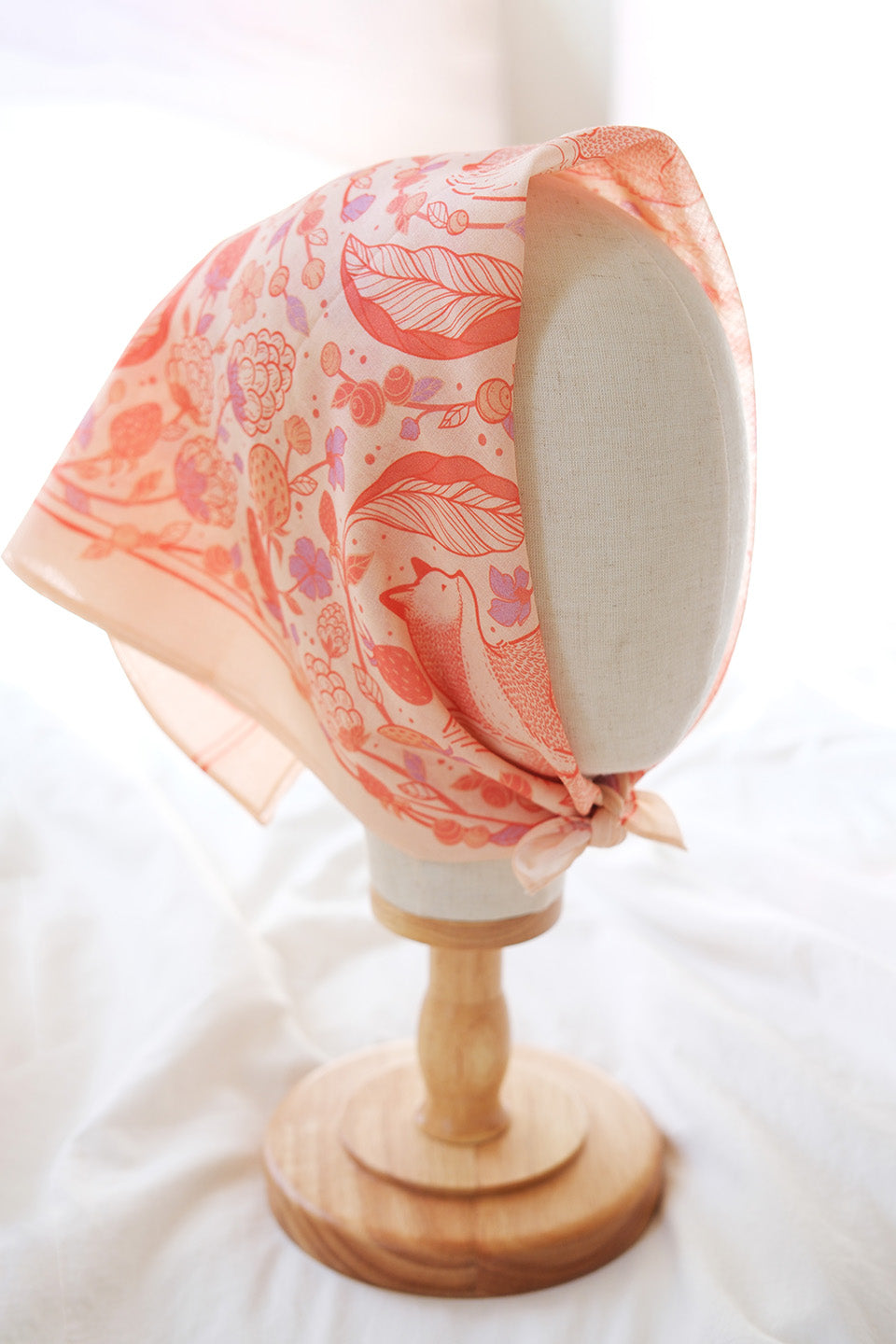 Fox&Berry blush bandana scarf with red fox and berry design displayed on a mannequin head.