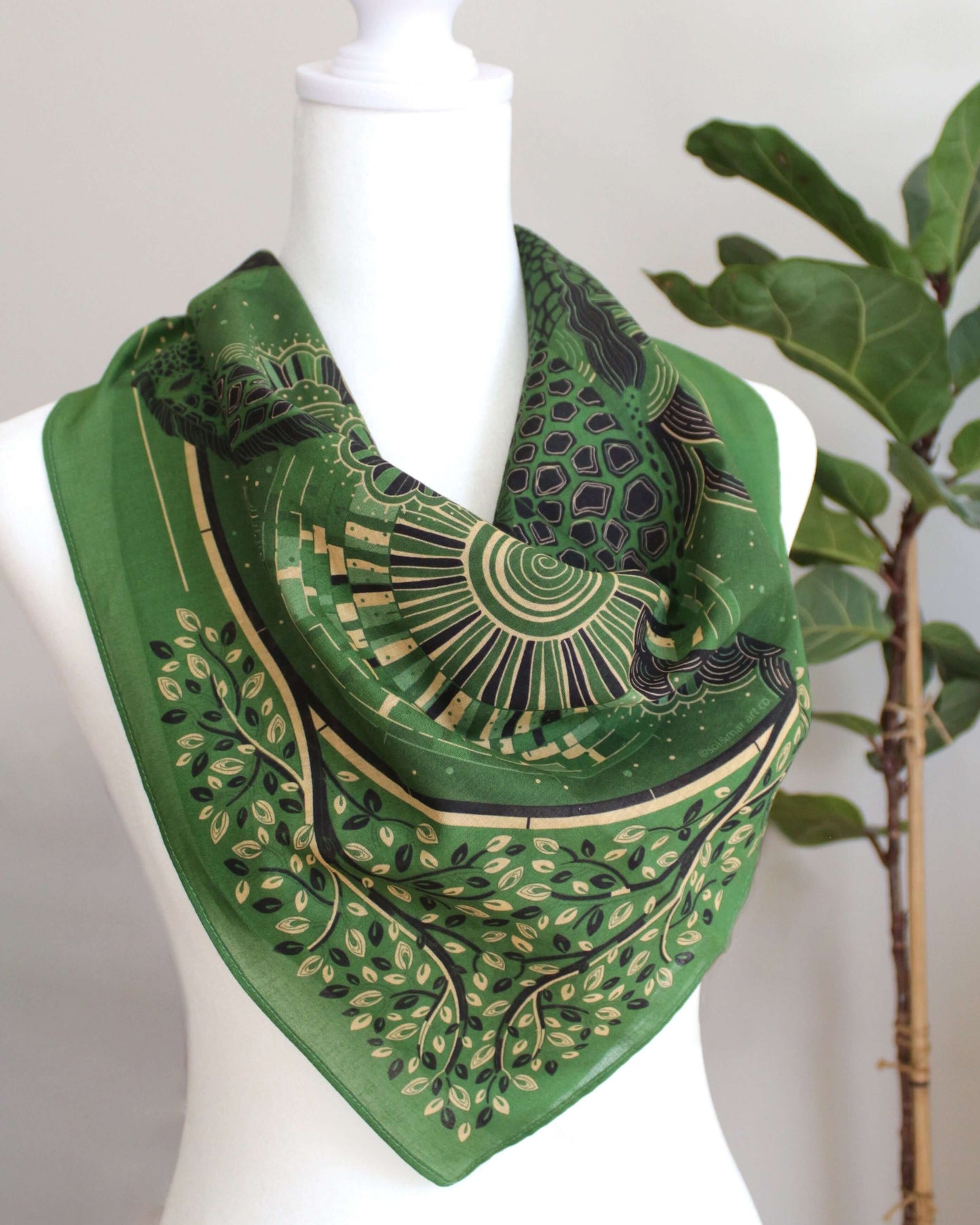 Olive green bandana scarf showcasing Giraffe family art amid grassland scenery, perfect for accessories and year-round wear.