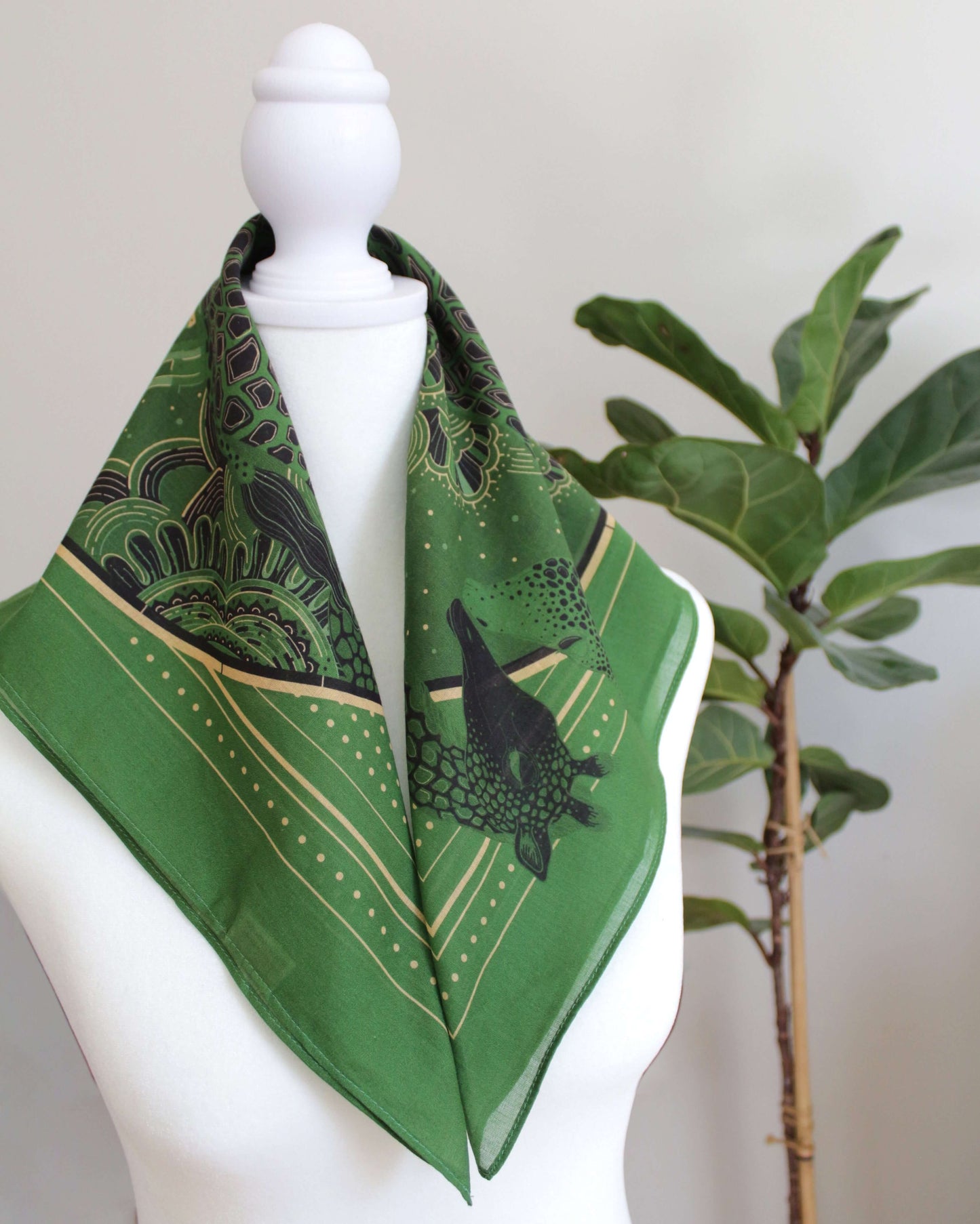 Olive green bandana scarf featuring a Giraffe family in a Savanna art design, perfect for hair or bag decoration.