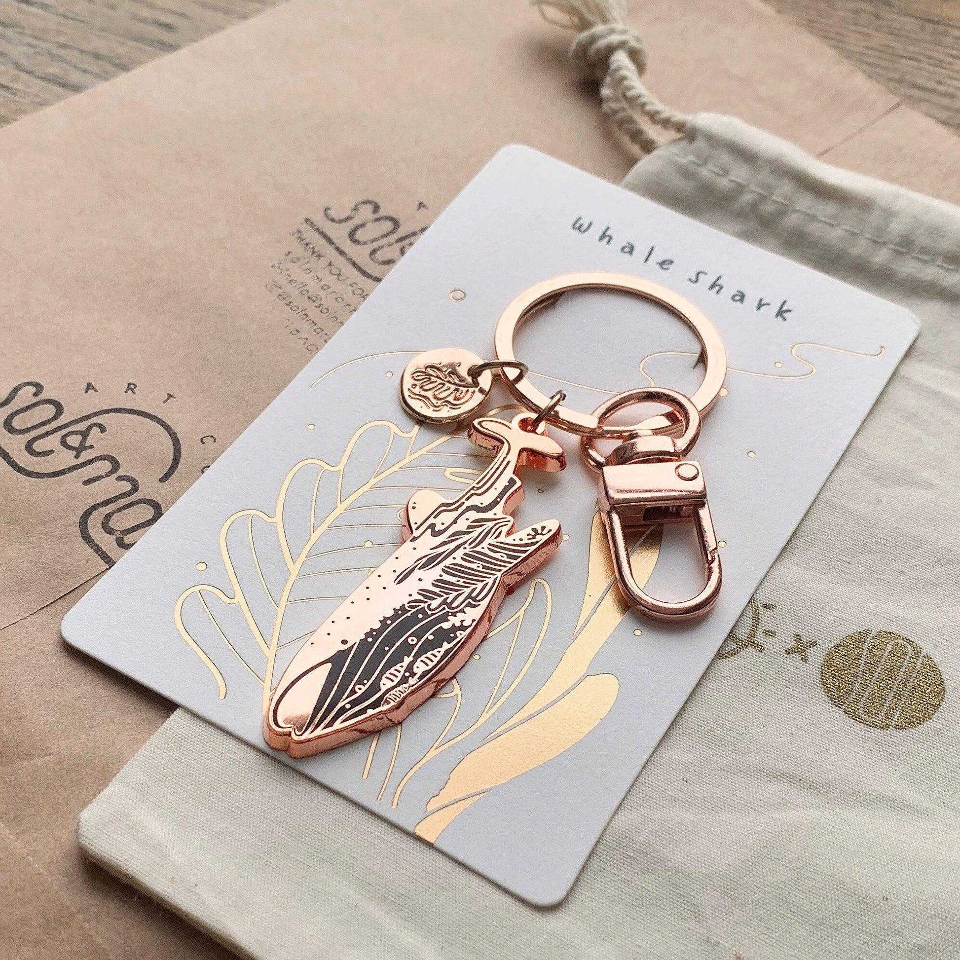 Whale Shark enamel keychain on display card with habitat art and WWf support information.