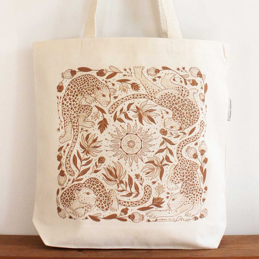 Leopard and Sun canvas tote bag featuring intricate line art design, perfect for shopping and everyday use.