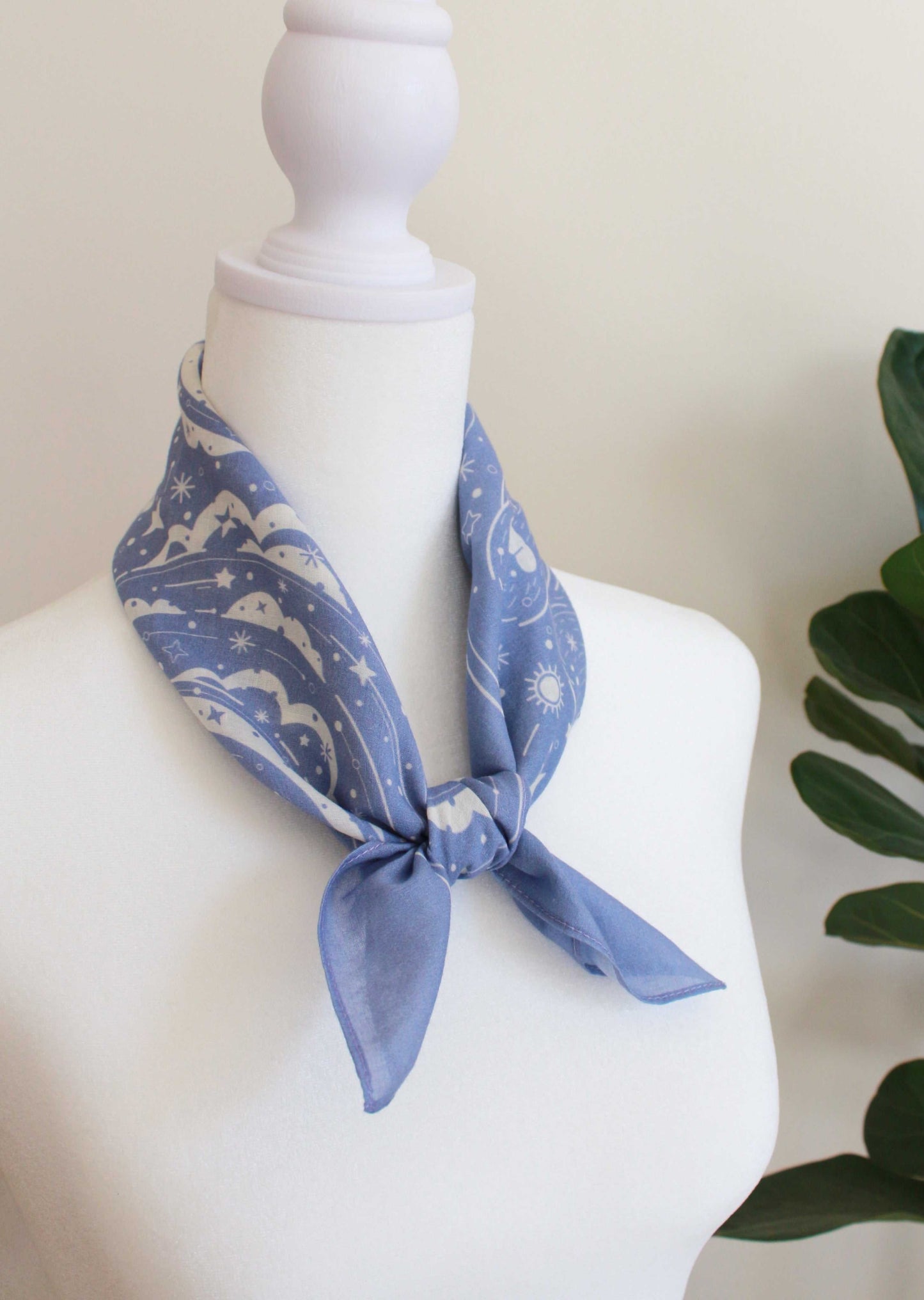 Lavender bandana scarf with polar bear and northern sky design, styled around a mannequin neck.