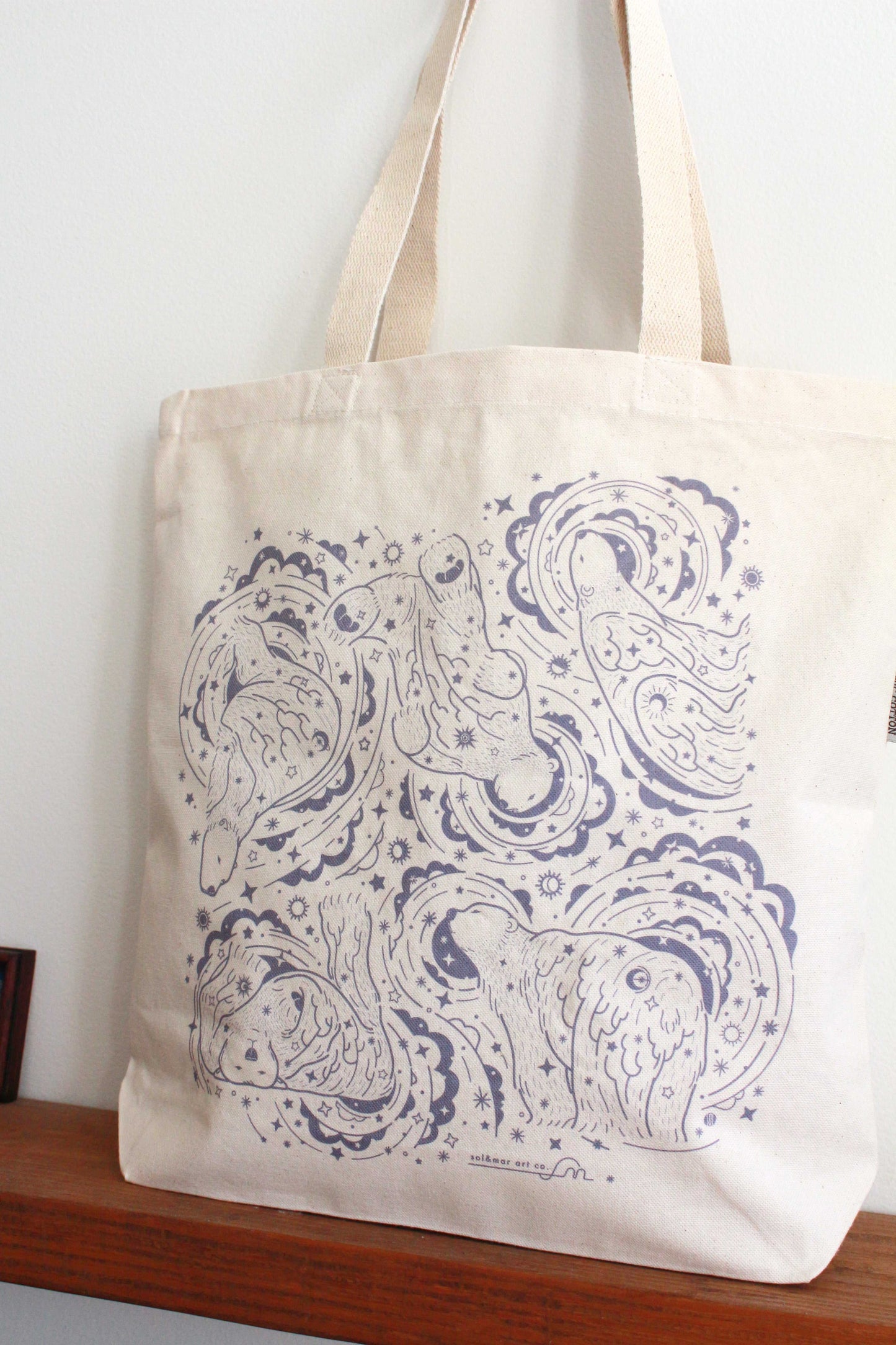 Canvas tote bag featuring whimsical polar bear and northern sky design, perfect for daily use and eco-friendly shopping.