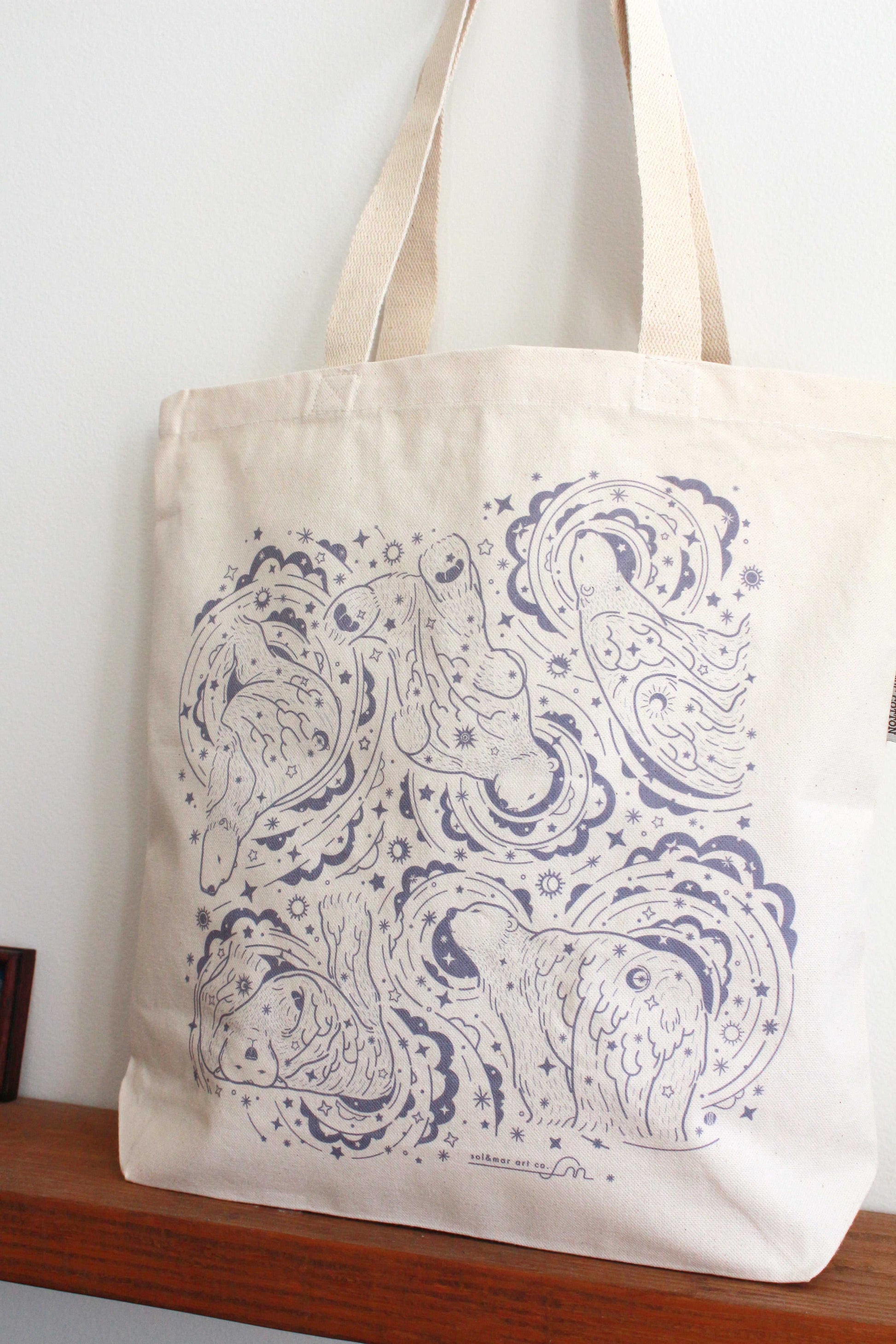 Canvas tote bag featuring whimsical polar bear and northern sky design, perfect for daily use and eco-friendly shopping.
