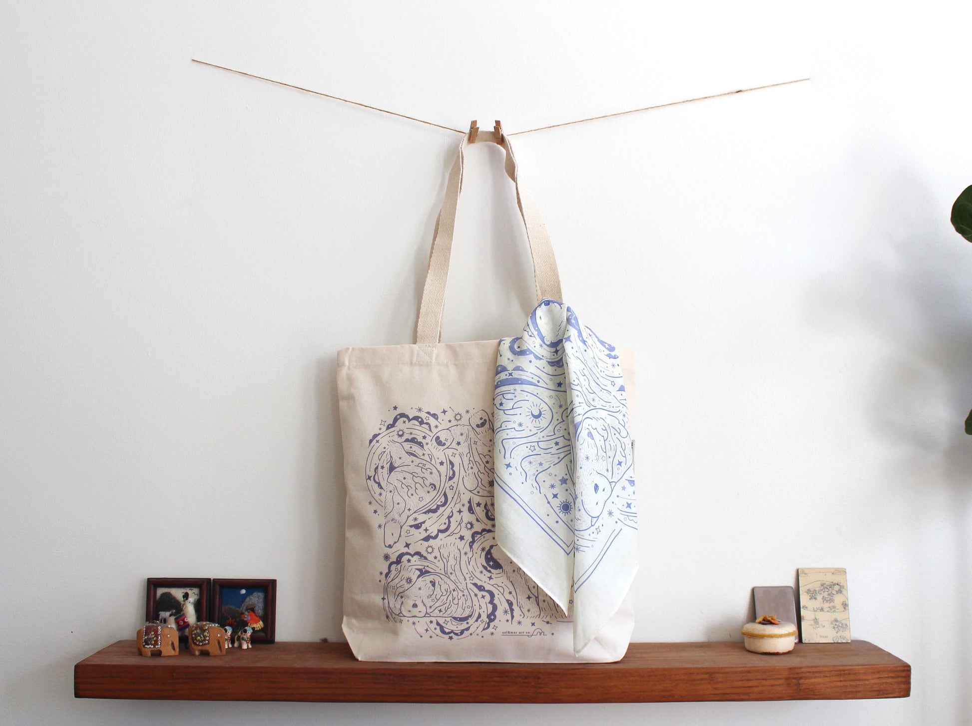 Stylish canvas tote bag with intricate blue print and matching bandana, perfect for everyday use and accessories.