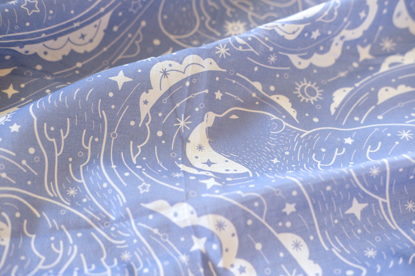 Polar Bear and Northern Sky bandana scarf in lavender fabric with whimsical white design.