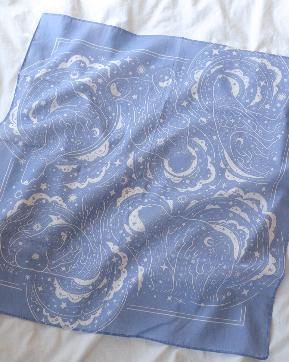 Soft lavender bandana scarf featuring polar bear and northern sky design, perfect for accessories or decor.
