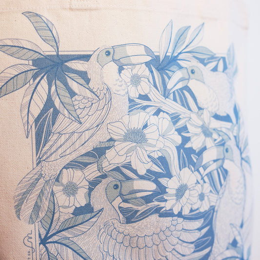 Canvas Tote bag with blue Toucan and floral pattern on beige background