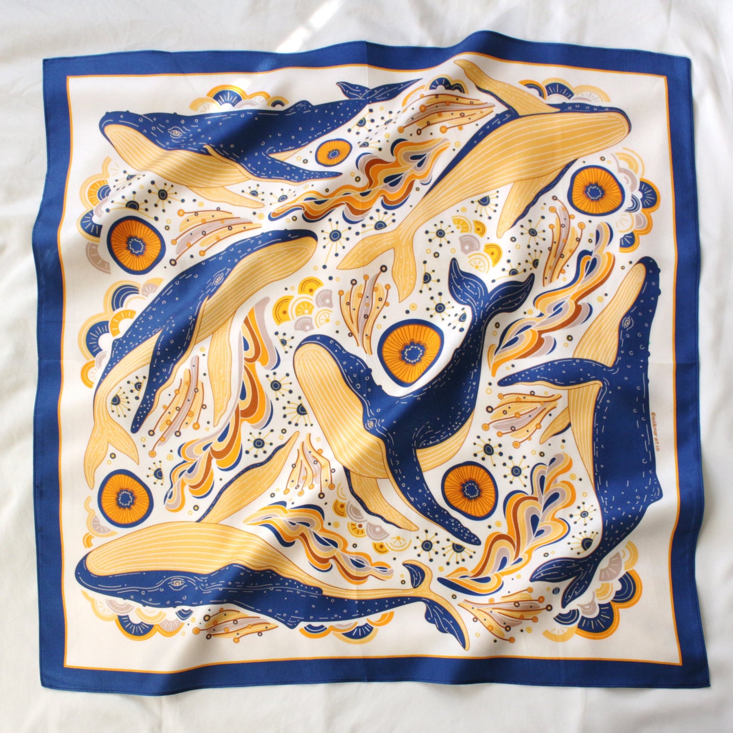 Whale and ocean themed silk twill scarf featuring illustrated humpback whales and vibrant ocean waves.