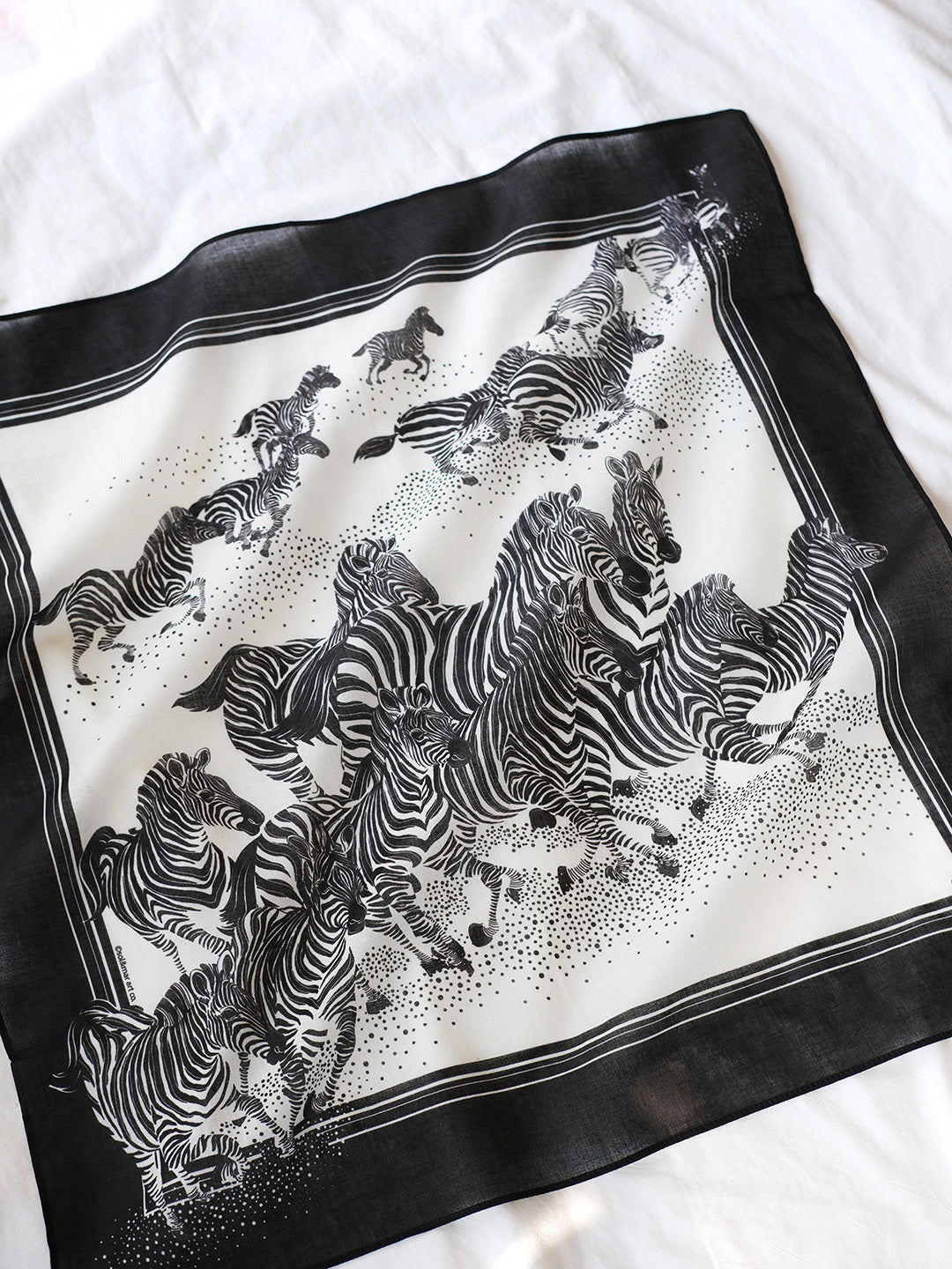 B&W zebra bandana scarf featuring a herd of zebras running, suitable for accessories or pet use.