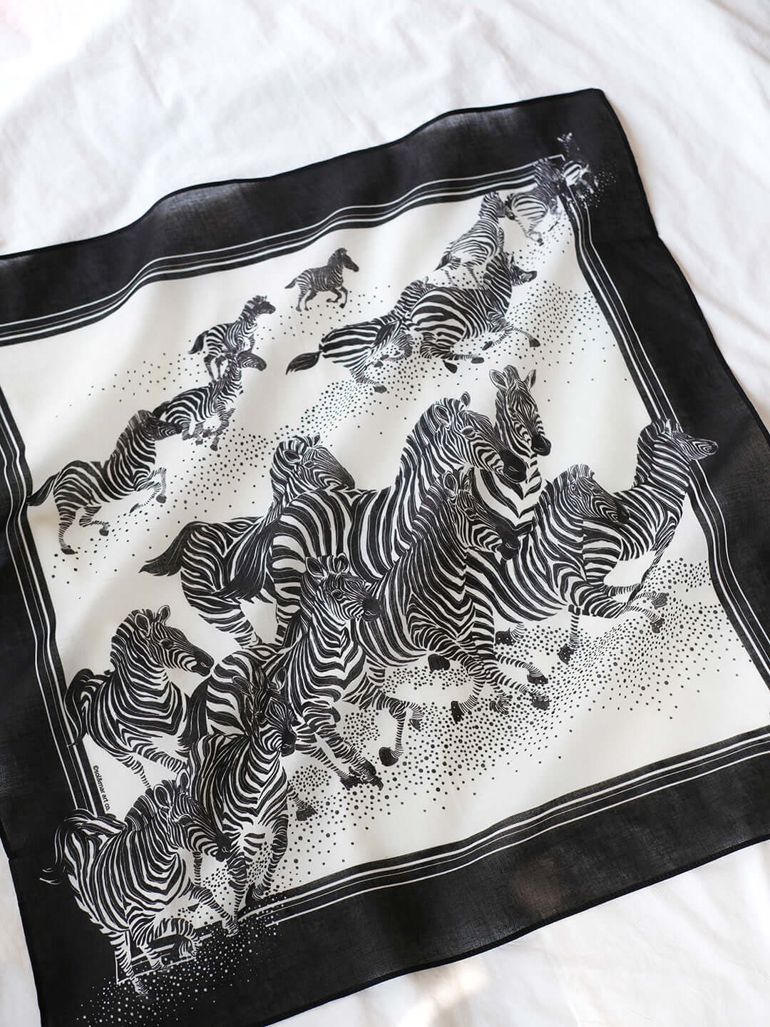 B&W zebra bandana scarf featuring a herd of zebras running, suitable for accessories or pet use.