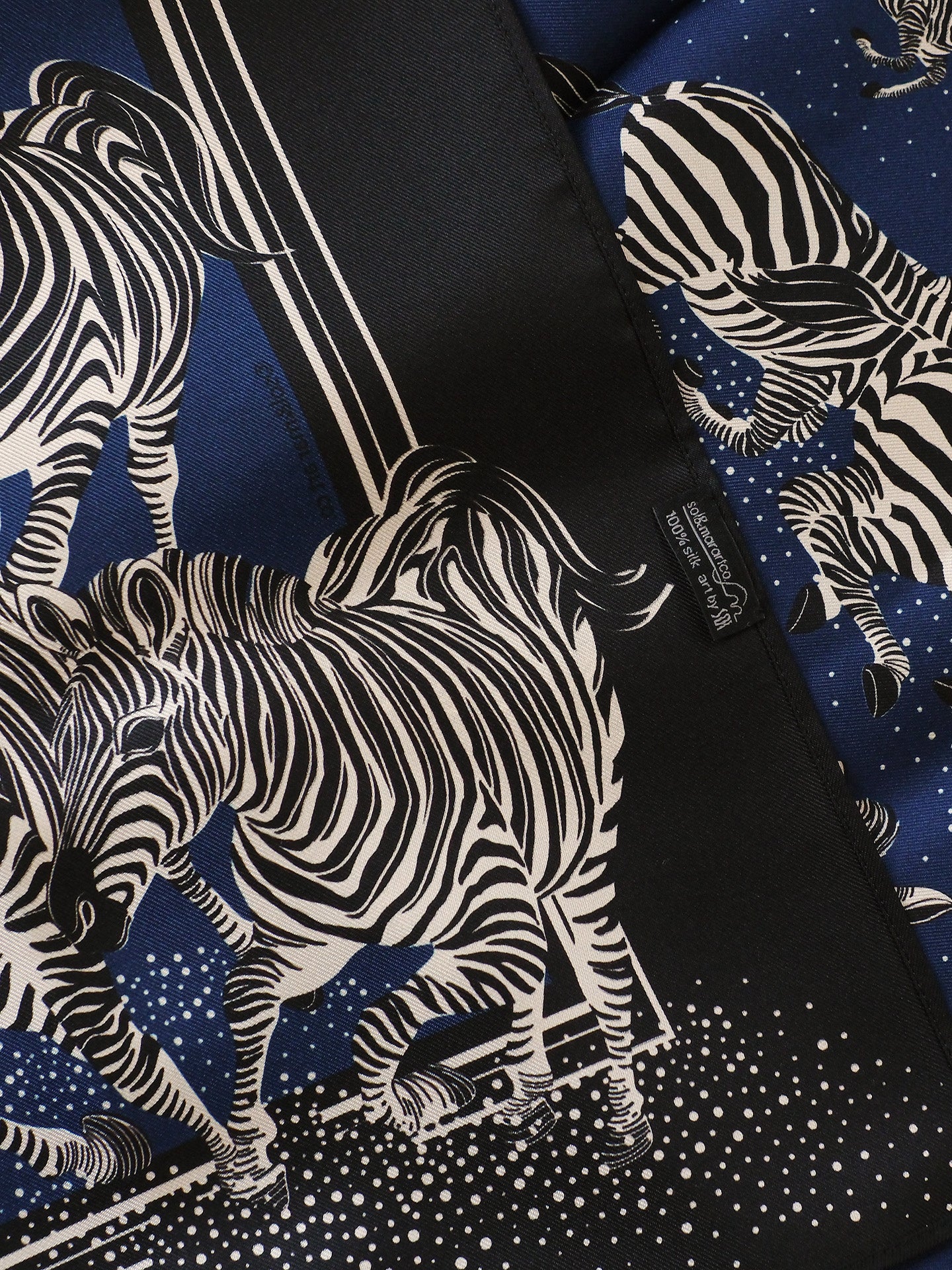silk scarf with zebra pattern on a blue background