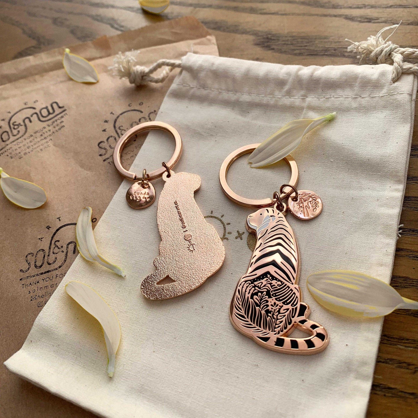 Sunda Tiger enamel keychain featuring delicate artwork and a round tag, supporting endangered animal awareness.