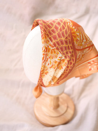 Decorative headscarf on a mannequin head with a soft background