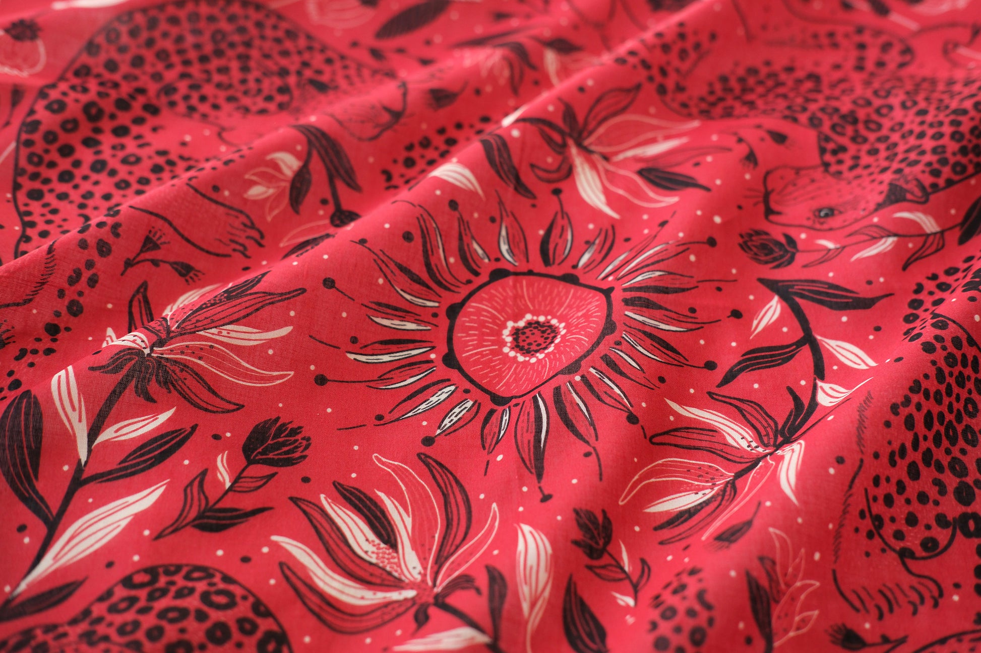Red fabric with black floral pattern