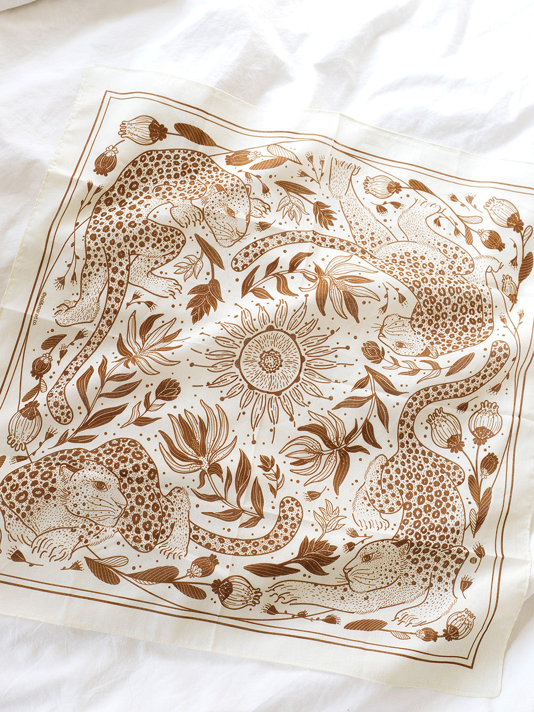 Off-white bandana scarf featuring leopard and sunflower line art design, perfect as a hair accessory or bag decoration.