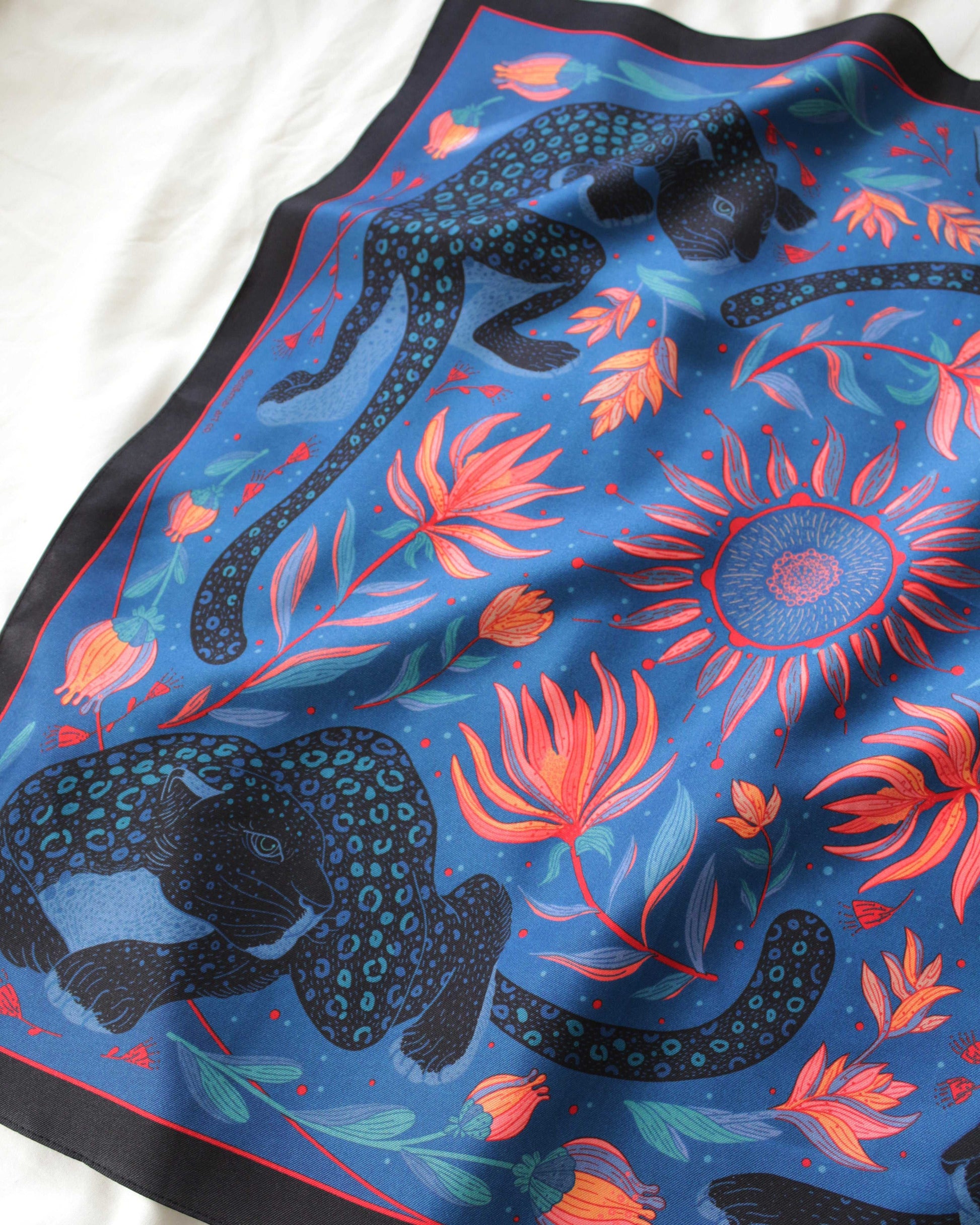 Leopard and the Sun Silk Twill Scarf featuring leopards, sun, and tropical flowers. 100% mulberry silk, 21x21 inches.
