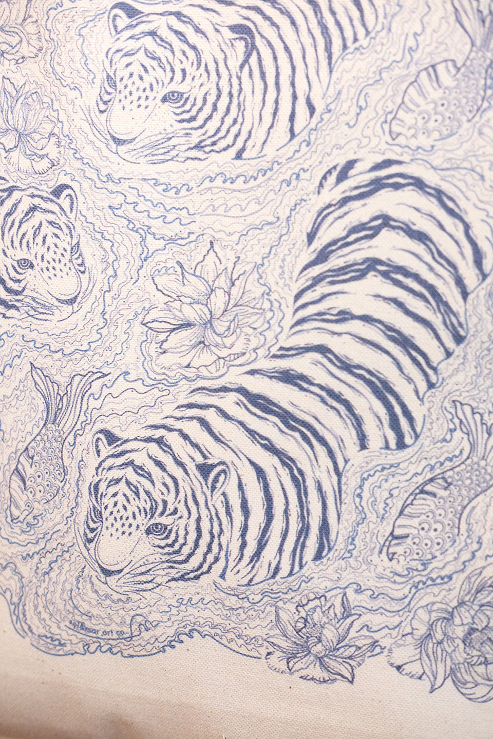 Artistic depiction of tigers and floral elements on a textured beige background