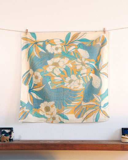 Toucan in Floral Jungle Bandana Scarf (Yellow) featuring tropical leaves and flowers, perfect for hair or bag accessories.