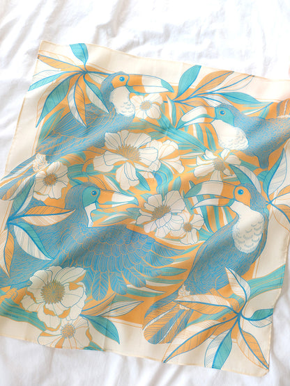 Toucan in Floral Jungle Bandana Scarf in yellow, featuring soft cotton and vibrant toucan artwork.