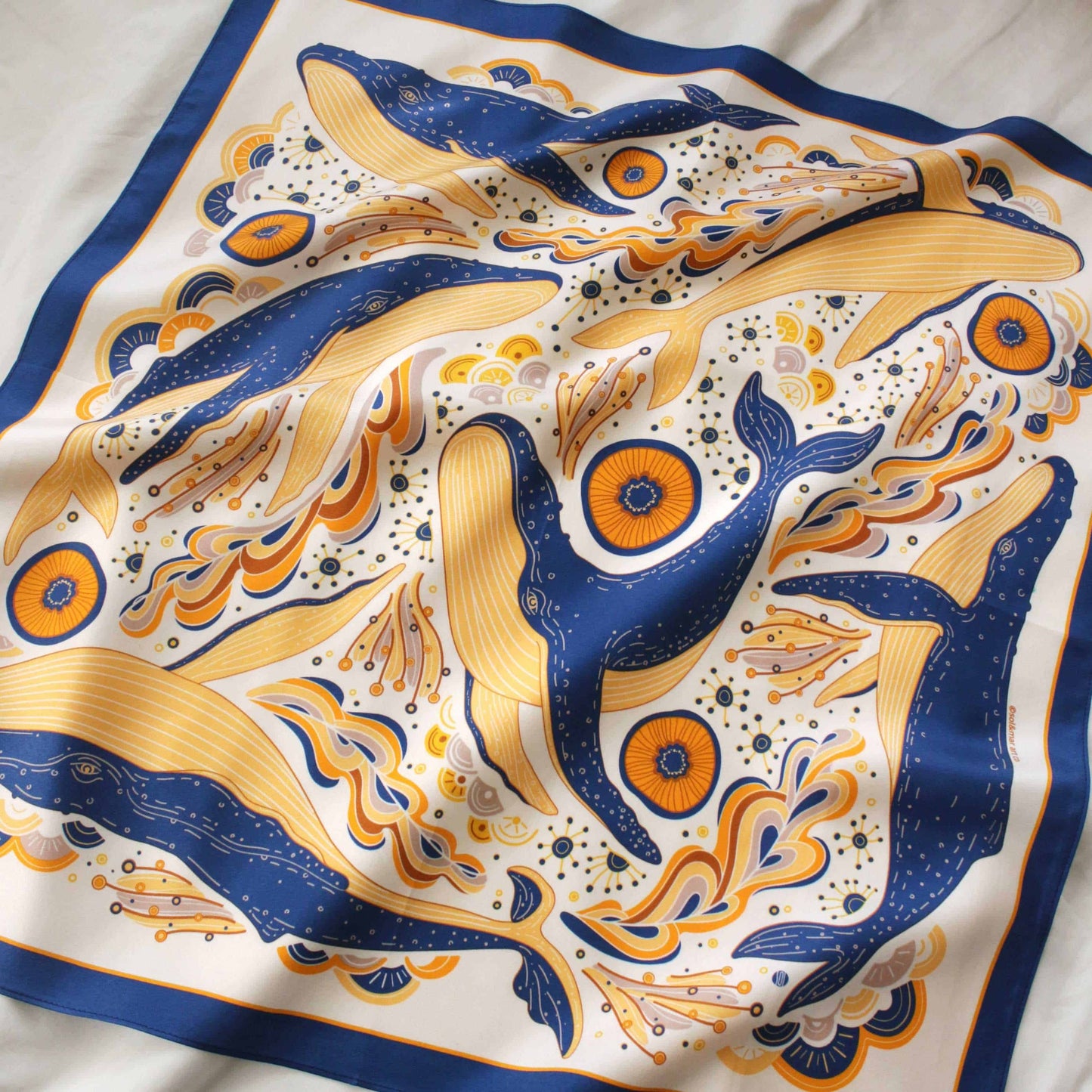 Whale and ocean design silk twill scarf featuring colorful humpback whales on a white background.