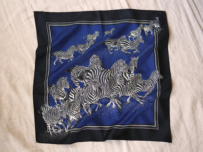 Silk scarf with zebra pattern on a blue background