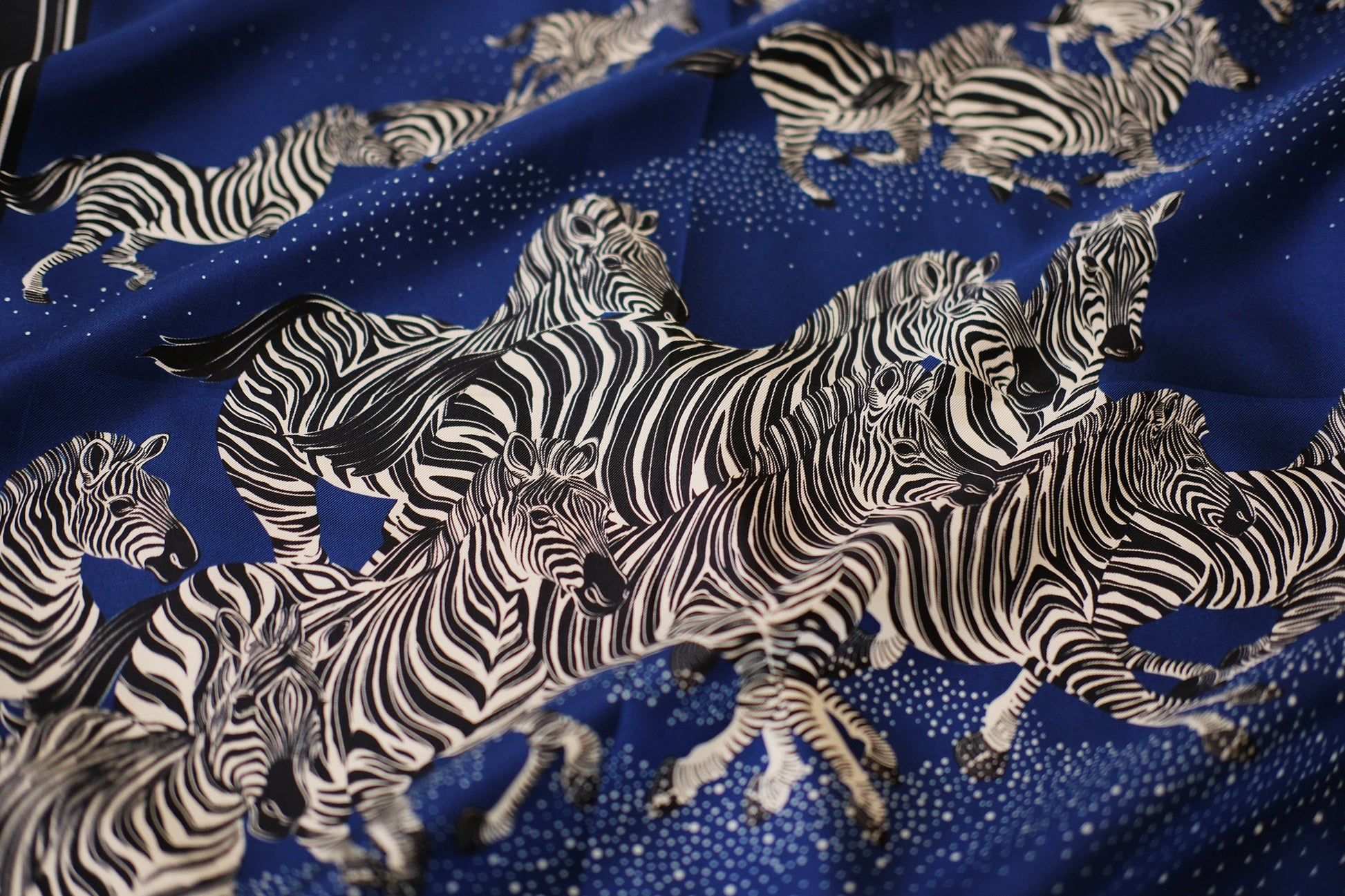 Fabric with zebra pattern on a blue background