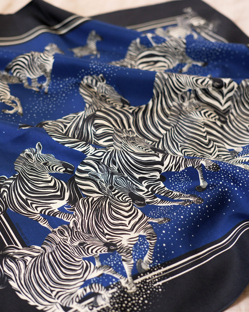 Silk scarf with zebra pattern on a blue background
