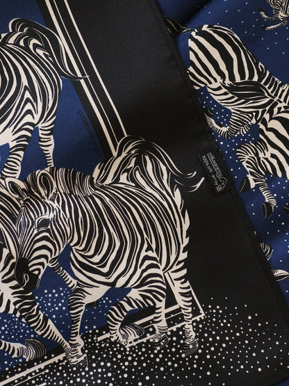 silk scarf with zebra pattern on a blue background